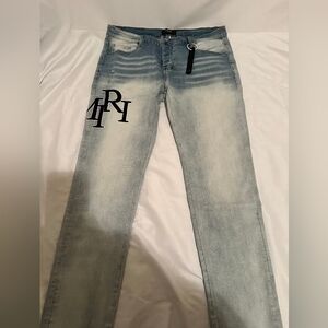 AMIRI Faded Blue Slim Jeans with Black Logo